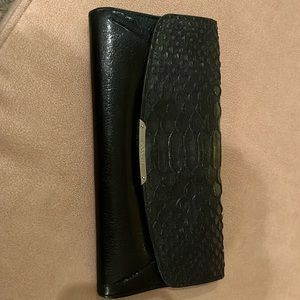 Coach black wallet with gold tag